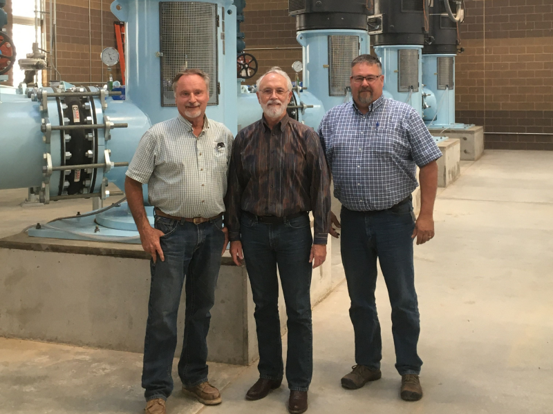 East Columbia Basin Irrigation District Board Members standing inside of a pumping facility